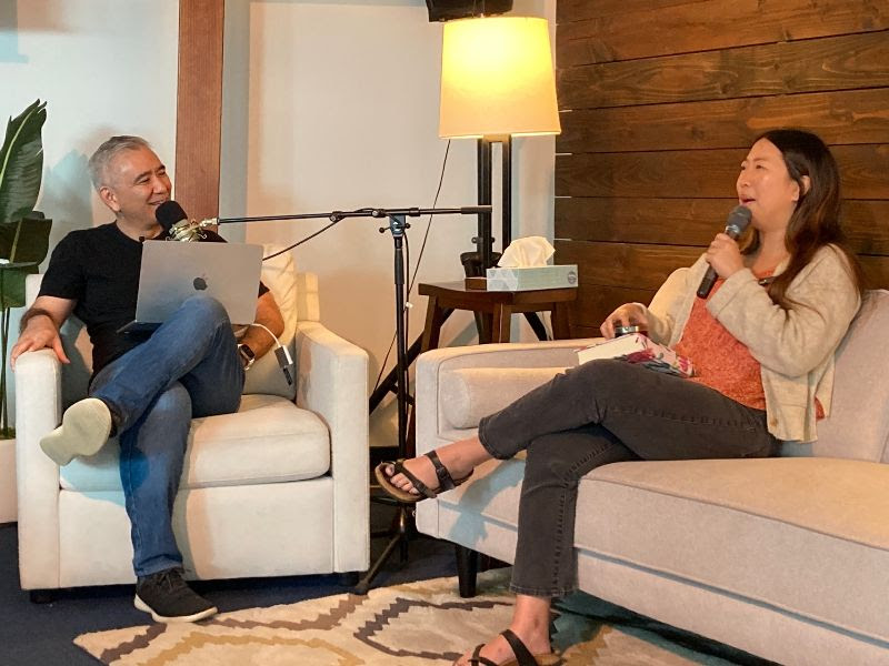 Anne sits down on the couch with Pastor Dave