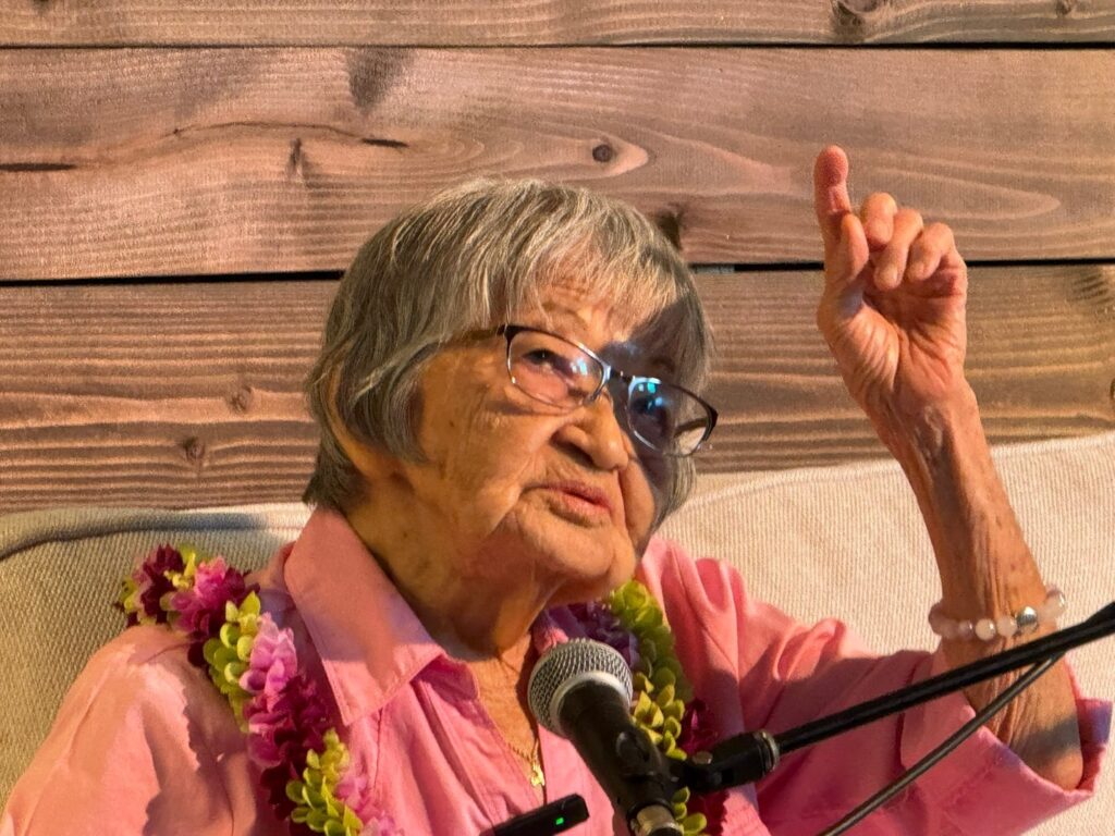 Aunty Sally sits down on the couch to share