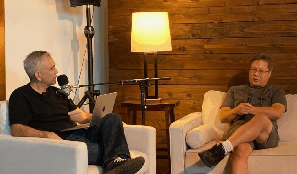 Chris sits down on the couch with Pastor Dave