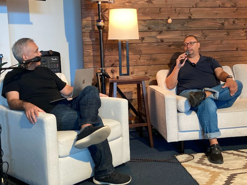Dave sits down on the couch with Pastor Dave