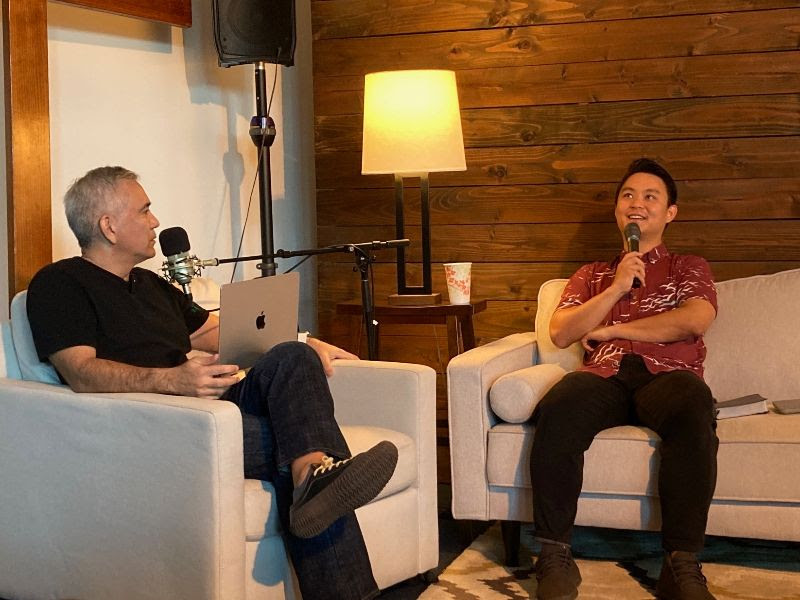 Josh sits down on the couch with Pastor Dave