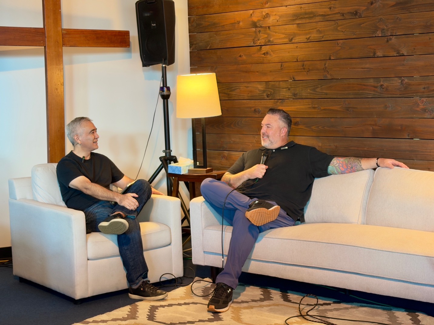 Justin sits down on the couch with Pastor Dave