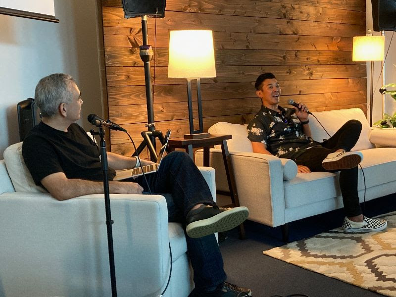 Micah sits down on the couch with Pastor Dave