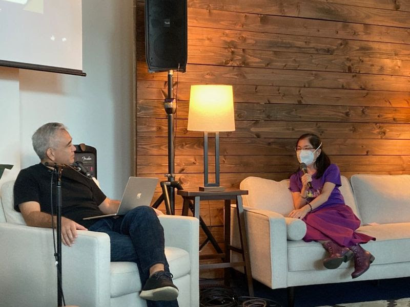 Michelle sits down on the couch with Pastor Dave