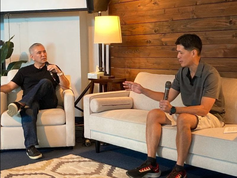 Patrick sits down on the couch with Pastor Dave